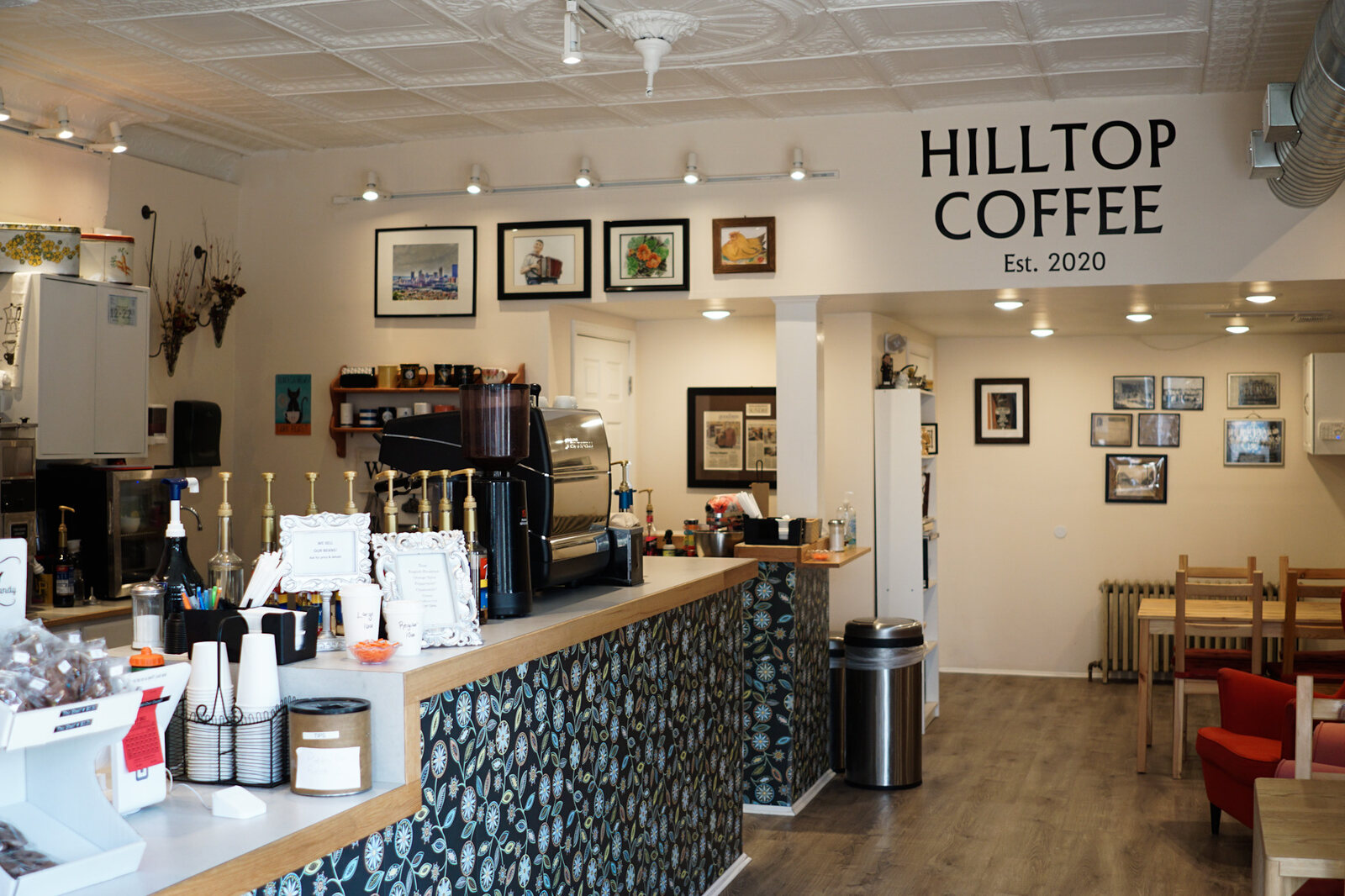 The counter, with framed prints on the wall